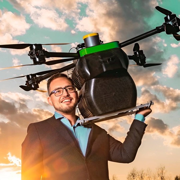 Vadym Melnyk holding one of his autonomous drones